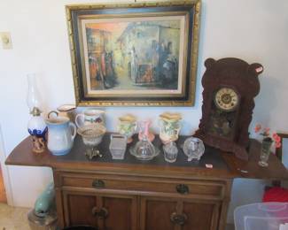 Very nice server cabinet. Mantal clock, USA pottery (Hull). Collectible vintage glassware. Vintage milk pitcher and others. 3 Small pcs. of Lenox and other collectibles.