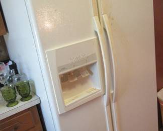 Working two door refrigerator with working ice maker.