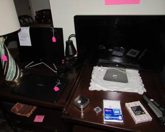 Mac PC, another PC, and a laptop
