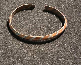 Copper and silver bracket