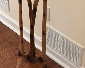 Base of hand carved giraffe