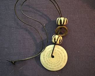Circular lower piece with beads necklace