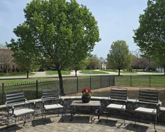 4 Iron patio chair and side table. $75 Each