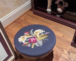 Lots of cool needlepoint pieces including this antique footstool