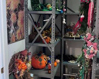 An entire walk in storage closet filled with sorted by holiday decorations. All the shelves are also for sale. Great for a storeroom. Safe room. Craft Room, Pantry or garage storage !