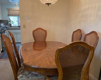 69 by 43 with two leaves for a total of 109 by 43. 8 chairs. Beautiful condition. Includes table protector. 