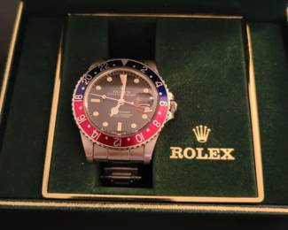 Rolex GMT with box and papers.