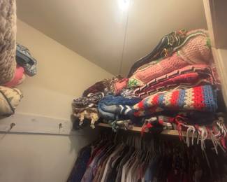 Lots of crochet blankets, other blankets , clothes and shoes available