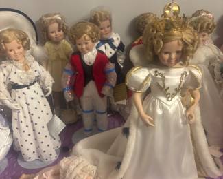 Many different porcelain Shirley Temple porcelain dolls