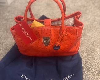 Brand new Dooney & Bourne purse. Still has tags. Beautiful purse