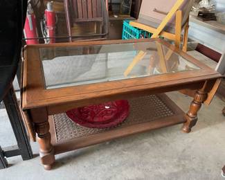 glass top coffe table with caning below