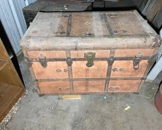 redish trunk from tall bldg