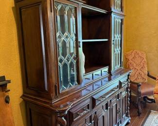 Touch lighted hutch with leaded glass and one of the armed chairs
