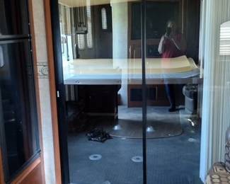 Sliding glass door leading into toyhauler and bunks
