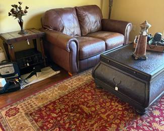 Leather loveseat, Karastan rug, coffee table and decor