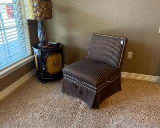 Brown chair with round table and lovely lamp