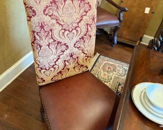 Chairs from Swan's with leather, hobb nails and fabric. 10 with two having arms.  Can be sold separate or with the dining table