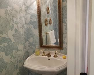 Kohler pedestal sink; wall mirror; vanity lights