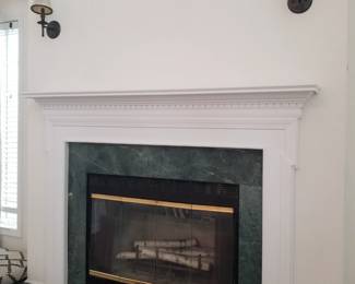 Wall sconces by Ballard Designs; fireplace insert; mantel