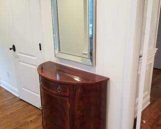 Handsome demilune cabinet by Henkel-Harris; made in USA in Winchester WV. Large wall mirror