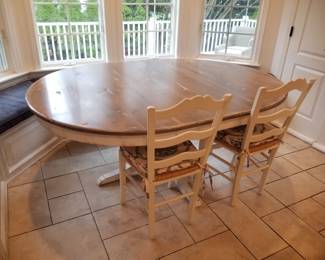 Country chic pedestal dining table with banquette seating & two chairs