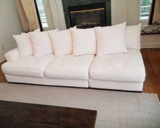 Elegant white sectional sofa consists of 4 pieces and can be configured in an L-shape. Made in USA by Jonathan Louis Inc., Gardena CA (two sections shown here)