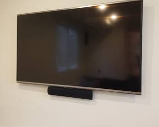 GoldenEar home theater includes TV, sound bar, 4 speakers & sub-woofer