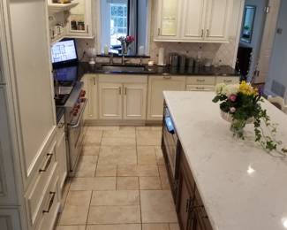 Kitchen has an island which houses Sharp microwave oven