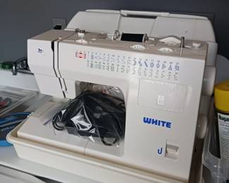 White multi-stitch sewing machine
