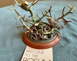 "Verdins" porcelain birds perched on a thorny branch from Boehm Porcelain.
