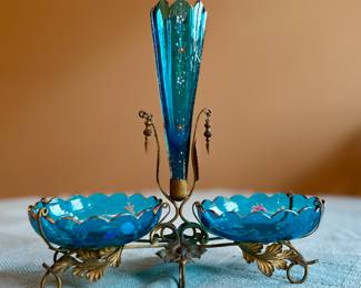 Enameled blue glass centerpiece vase and bowls on brass stand.