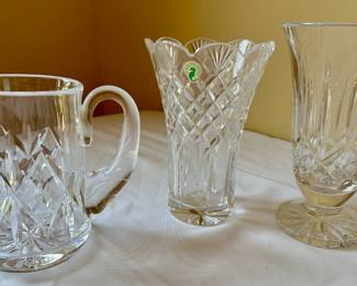 (left to right) Waterford Crystal Lismore pitcher. Waterford Crystal Copeland vase. Waterford Crystal Lismore vase.