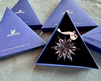 Swarovski snowflake ornaments in original boxes.