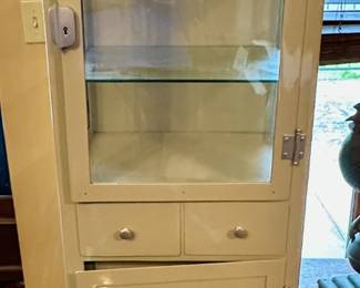 Early 1900s metal medical cabinet.