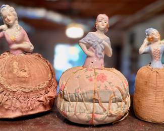 Pin cushion dolls with porcelain face and torso. Picture added 23-May-2025.