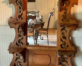 Victorian walnut etagere with marble top above a single drawer.