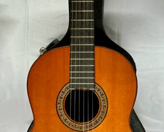 Handcrafted Yamaha GC-10D guitar with case. Label inside with craftsman's signature.