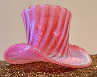 Cranberry opalescent spiral optic glass hat.