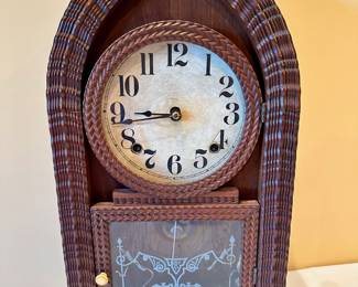 Mid-19th century beehive or ripple-front mantle clock.