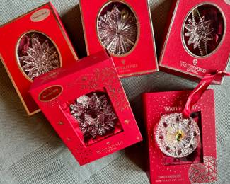 Dozens of Waterford snowflake ornaments.