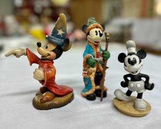 Various Disney Mickey Mouse figurines.