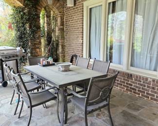 Outdoor table and chairs by Home Decorators Collection with sunbrella cushions.