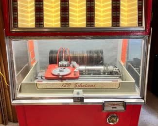 AMI model number F – 120 vintage Juke Box .. works!! Needs some fine tuning . Comes with a fabulous collection of 45’s . Has a good sound.