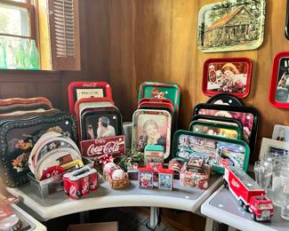 Many many Coca Cola trays and tons of Coke memorabilia