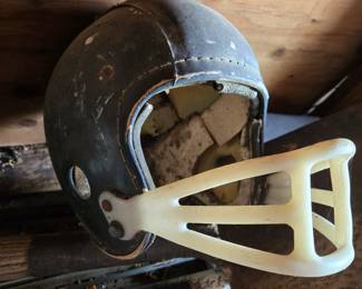 Pair of vintage football helmets
