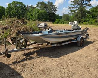 Cimmarron fishing boat with Johnson outboard and Shoreline boat trailer