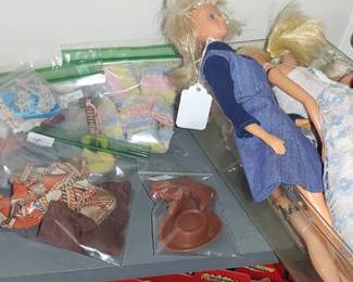 We finally found the Barbies out in the building Barbie clothes and some Ken dolls and Barbies