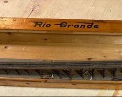 Narrow track model railroad in handmade case.