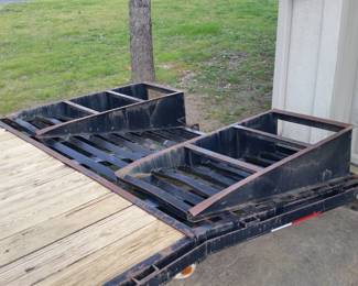 The steel dovetail section is 5 ft long. The ramps are hinged and have spring assist.