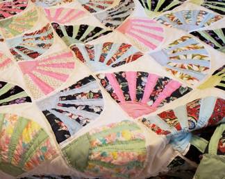 This 'fan' quilt is hand stitched.